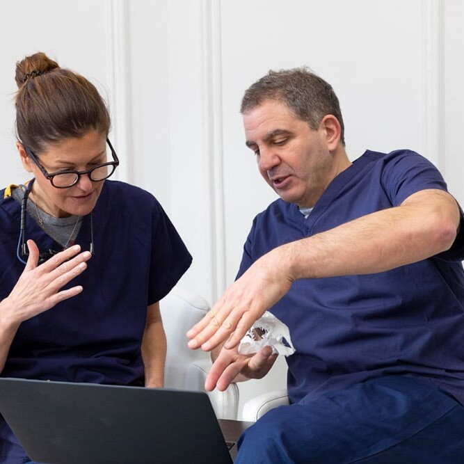 Dr Fiona McKillop and Dr Andrew Dawood consulting on Dental Implant Case